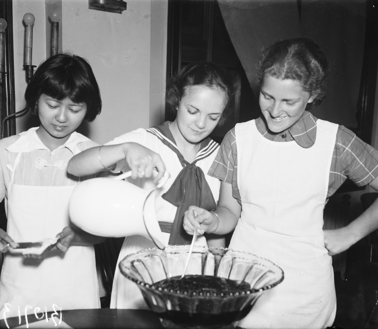 3 Young Women Making Punch and Refreshments