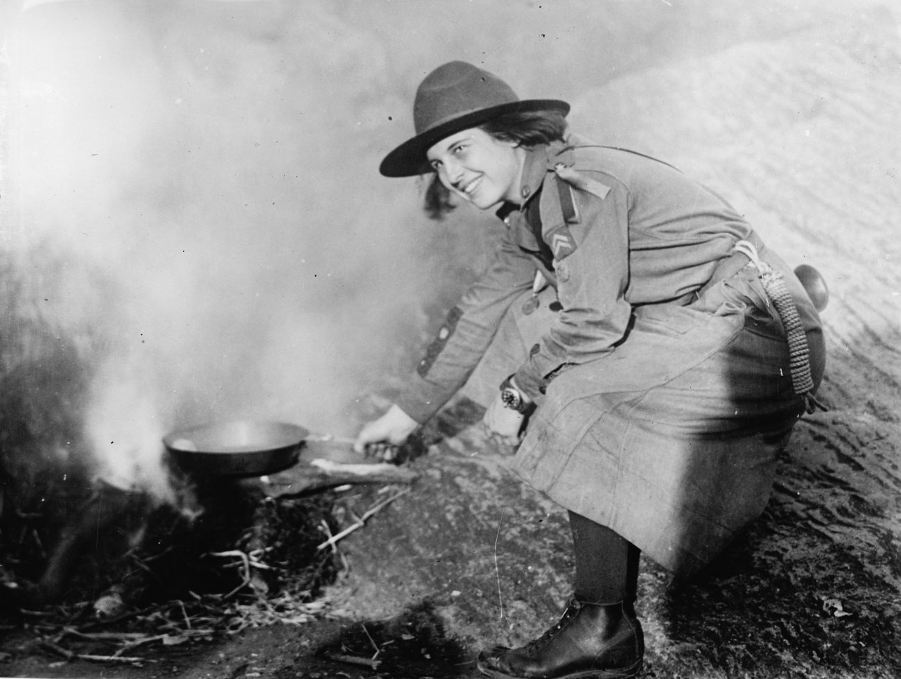 Girls Scout Cooking Over Open Fire