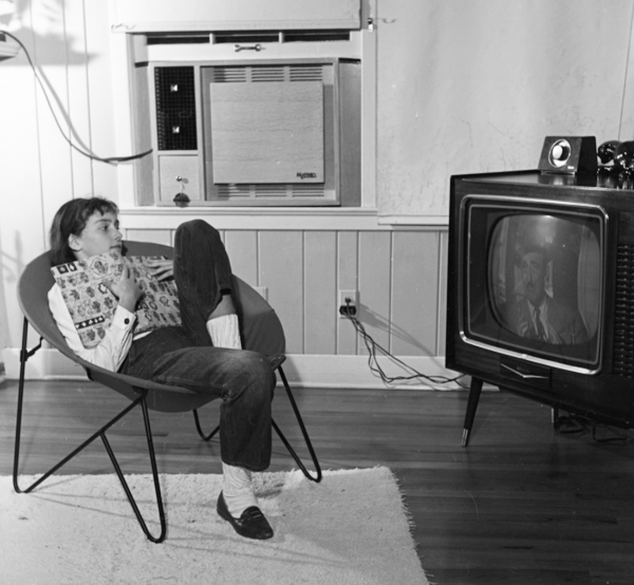 Teen Girl Watching TV and Reading in Jeans
