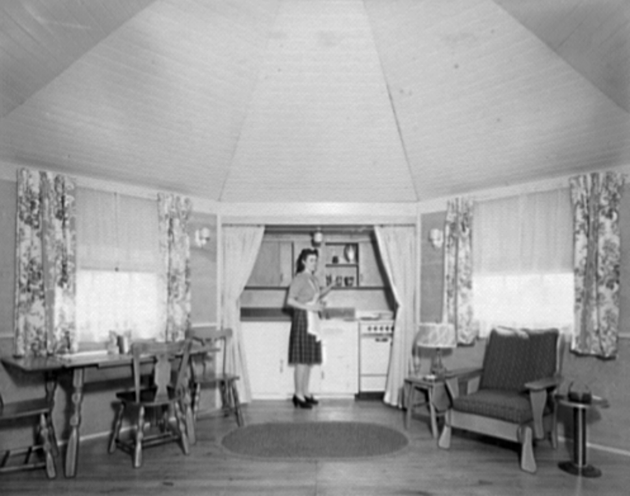 Woman in 1940s Portable House Provided by Rocky Mountain Lumber Co