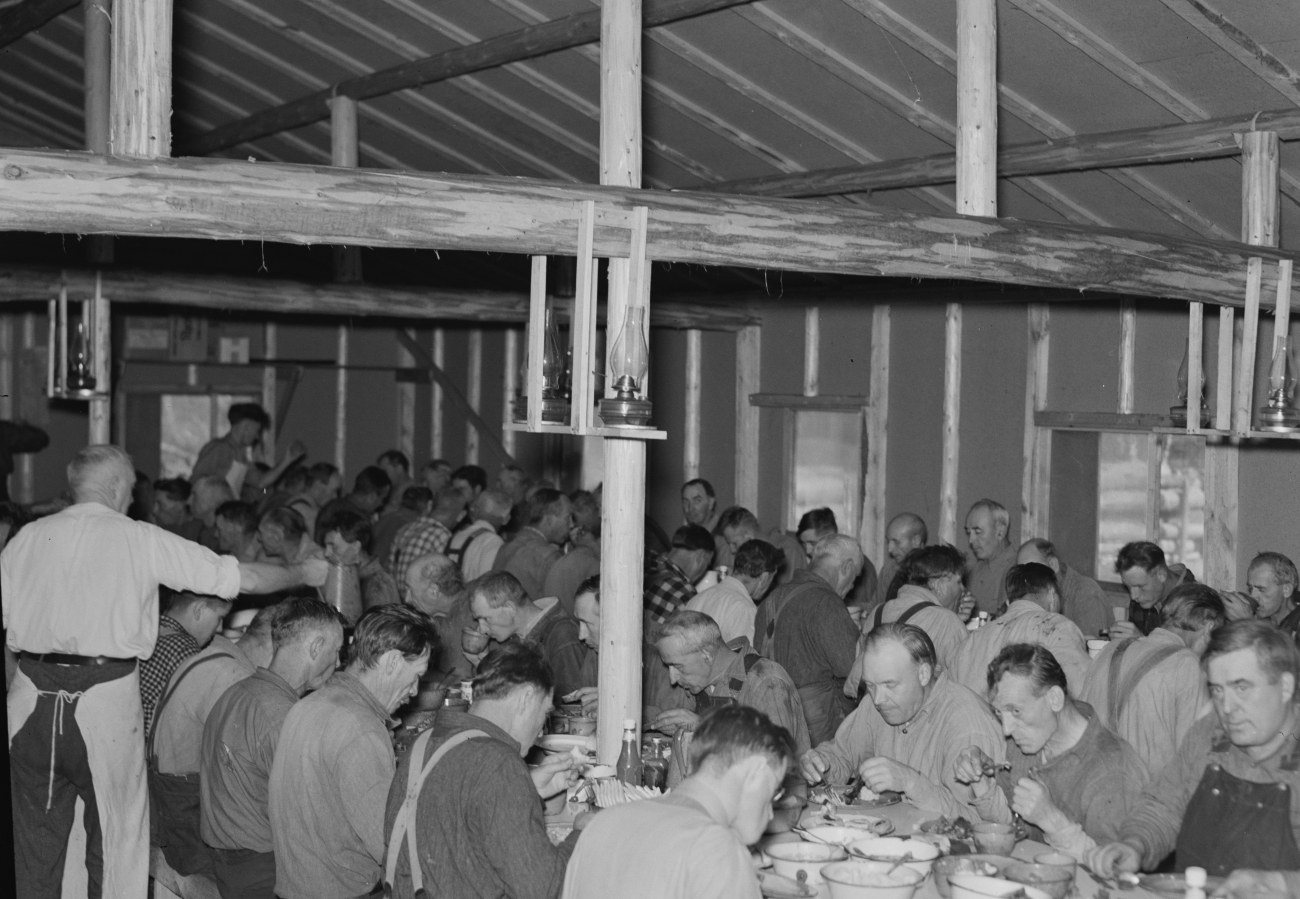 Lumberjacks in 1930s Camp Having A Meal