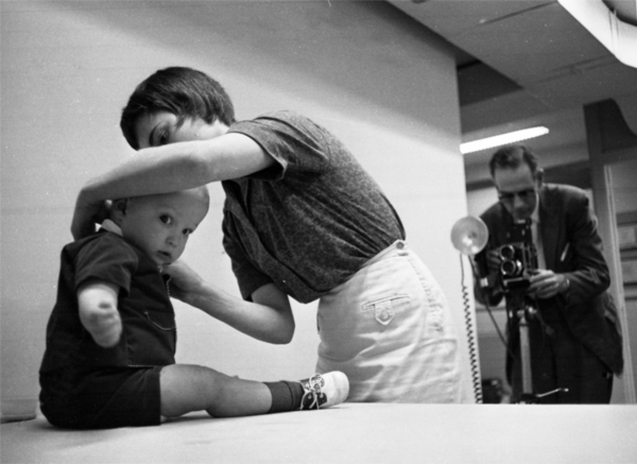 Mother Fixing Baby's Hair for Photos