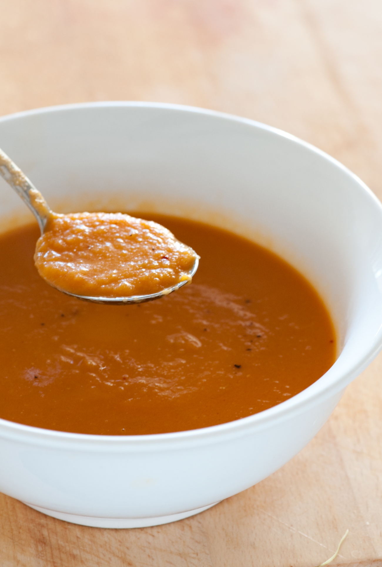 Soup Spoon Dipping into Red Soup