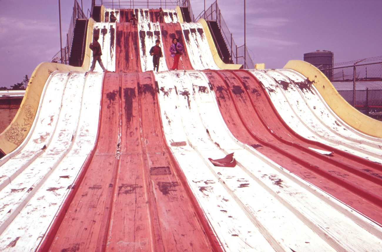 Kids playing on abandoned slide at Coney Island