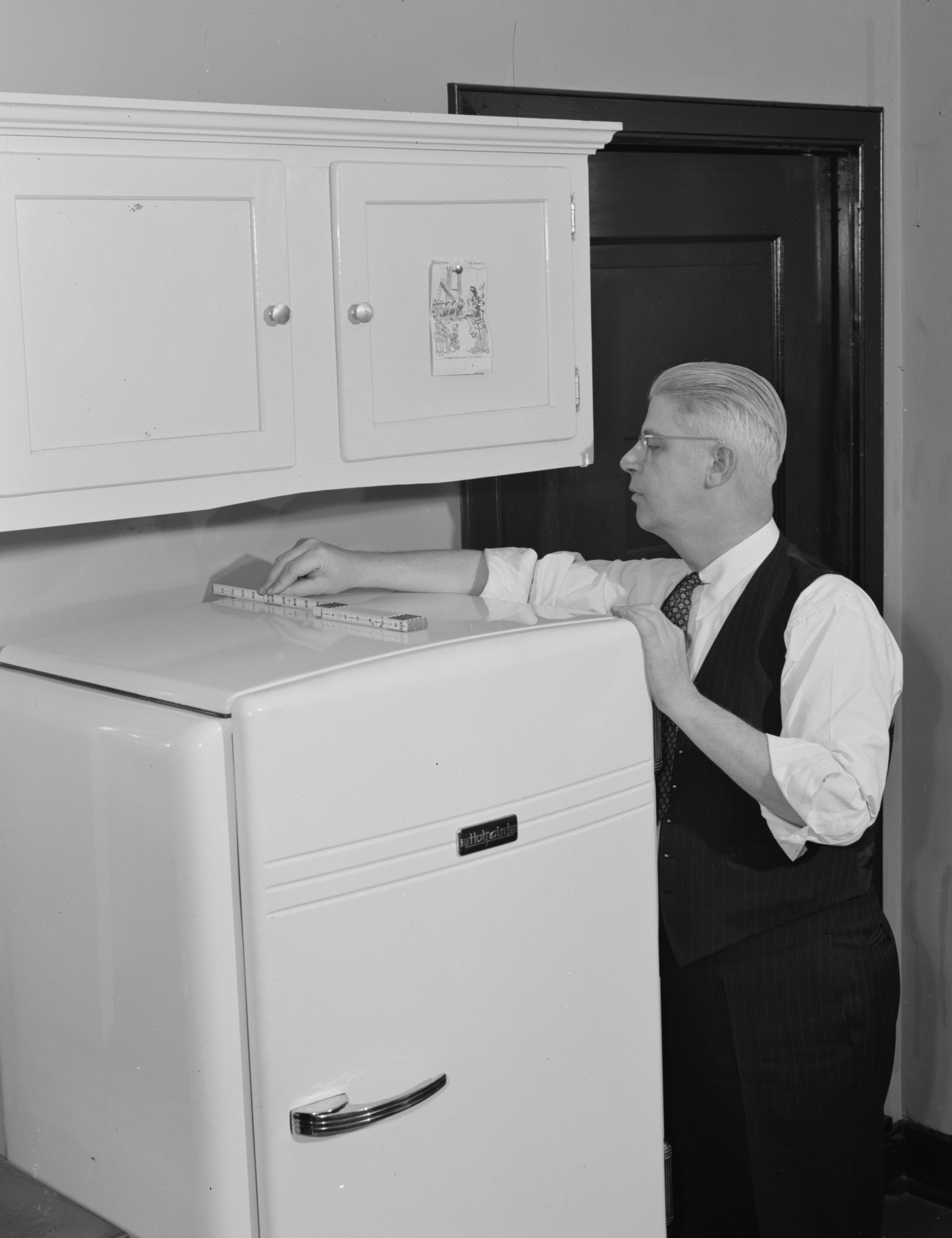 Measuring for a Refrigerator 1940s