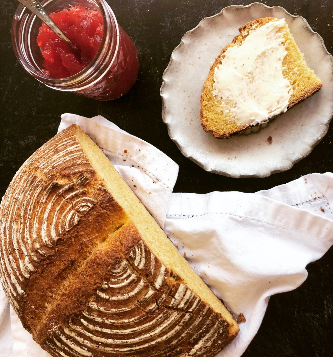 Round Loaf of Bread with Butter and Jam