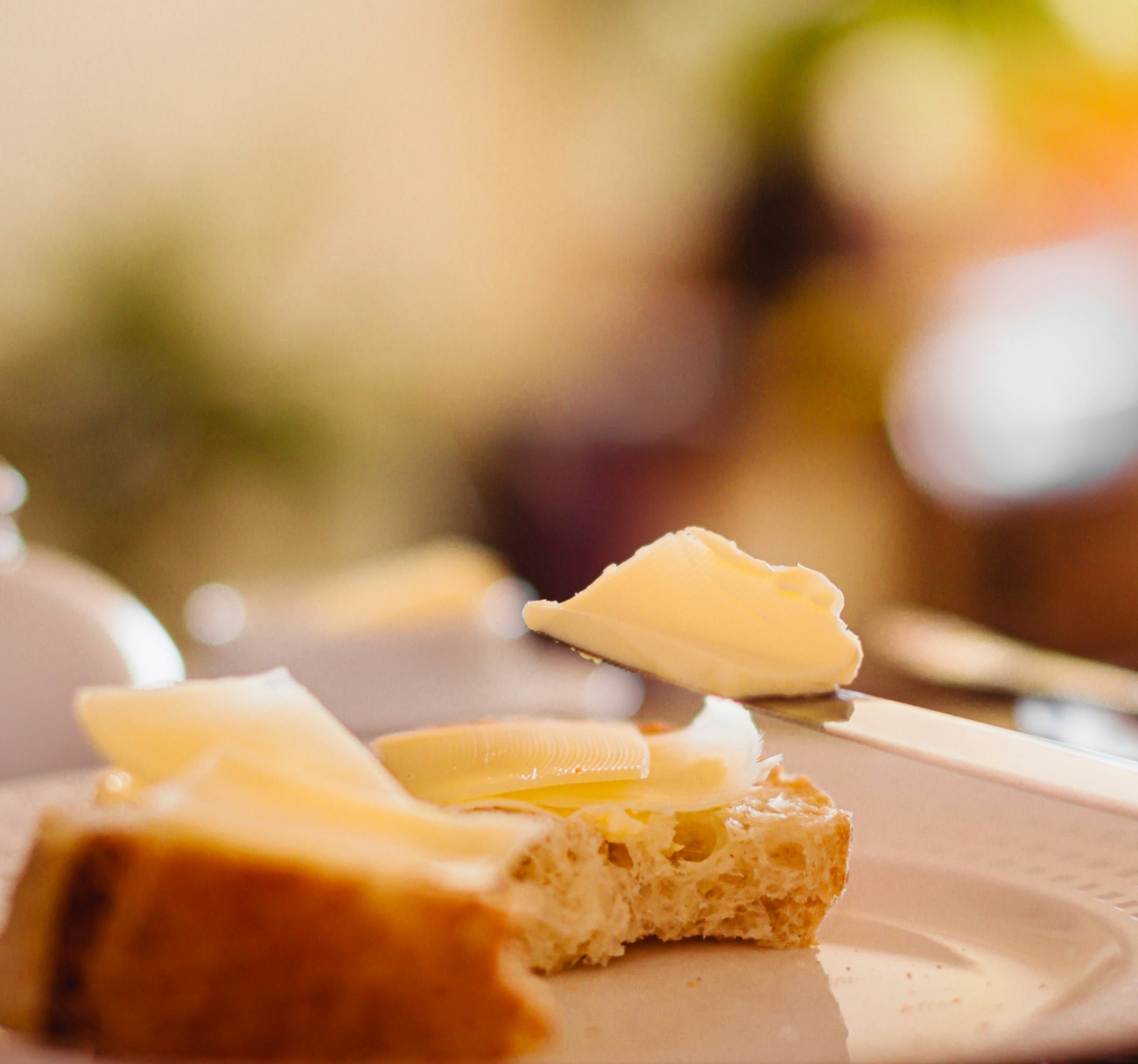 Butter on Bread with Plate and Knife
