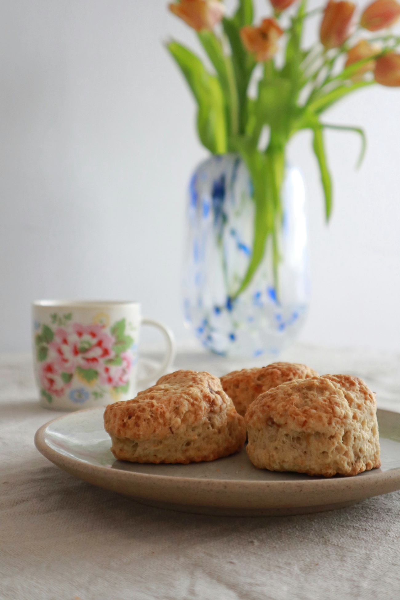Scones Tea and Flowers on a Table