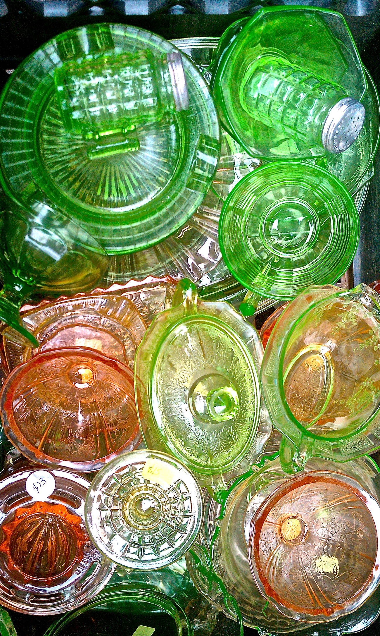 Pile of Pink and Green Depression Glass Pieces