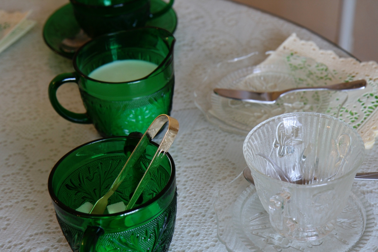 Green Depression Glass Pieces on Table