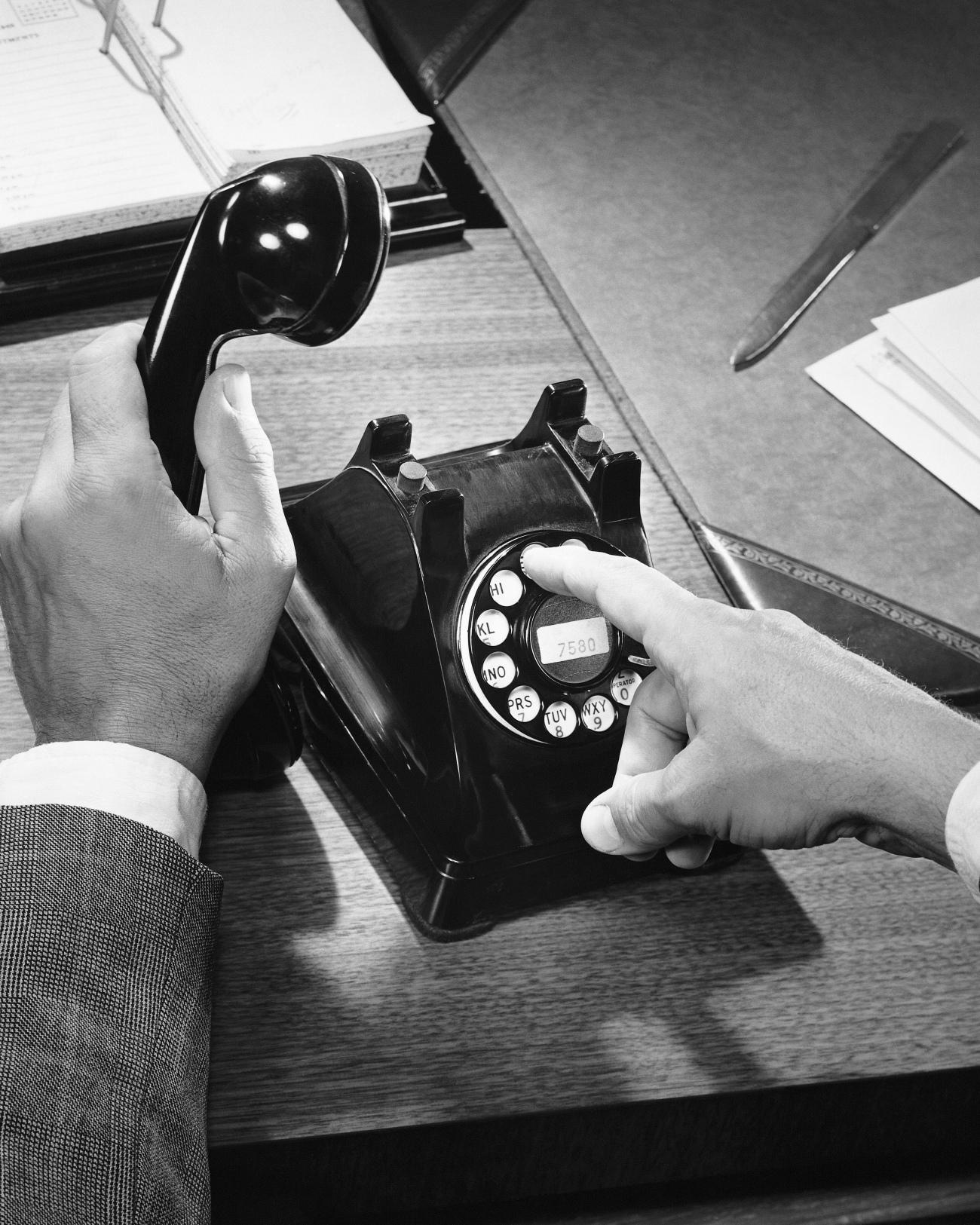 Man Dialing Old Fashioned Rotary Phone