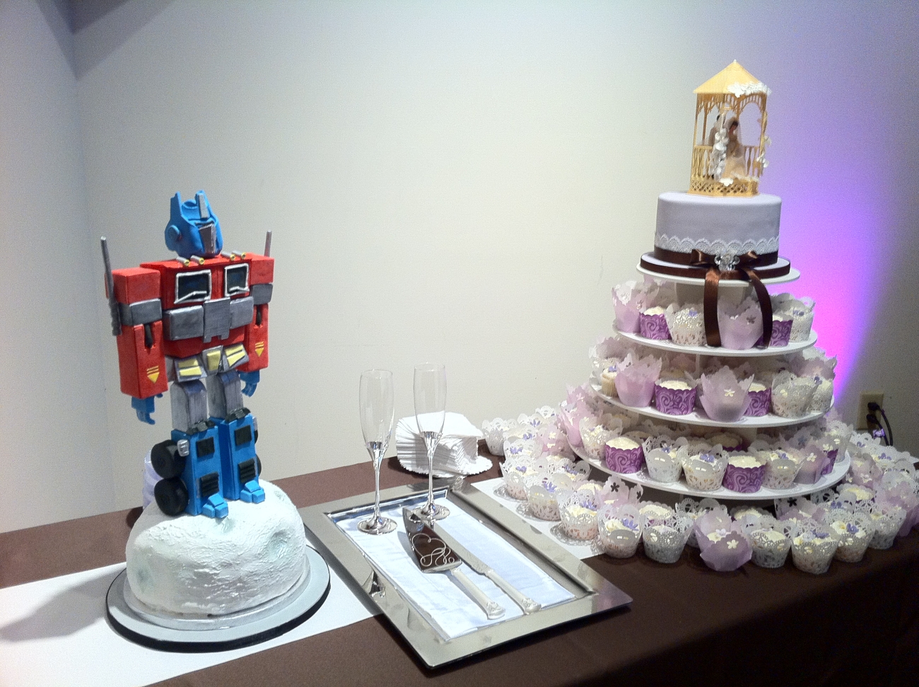 Transformers Groom Cake Next to Wedding Cupcakes
