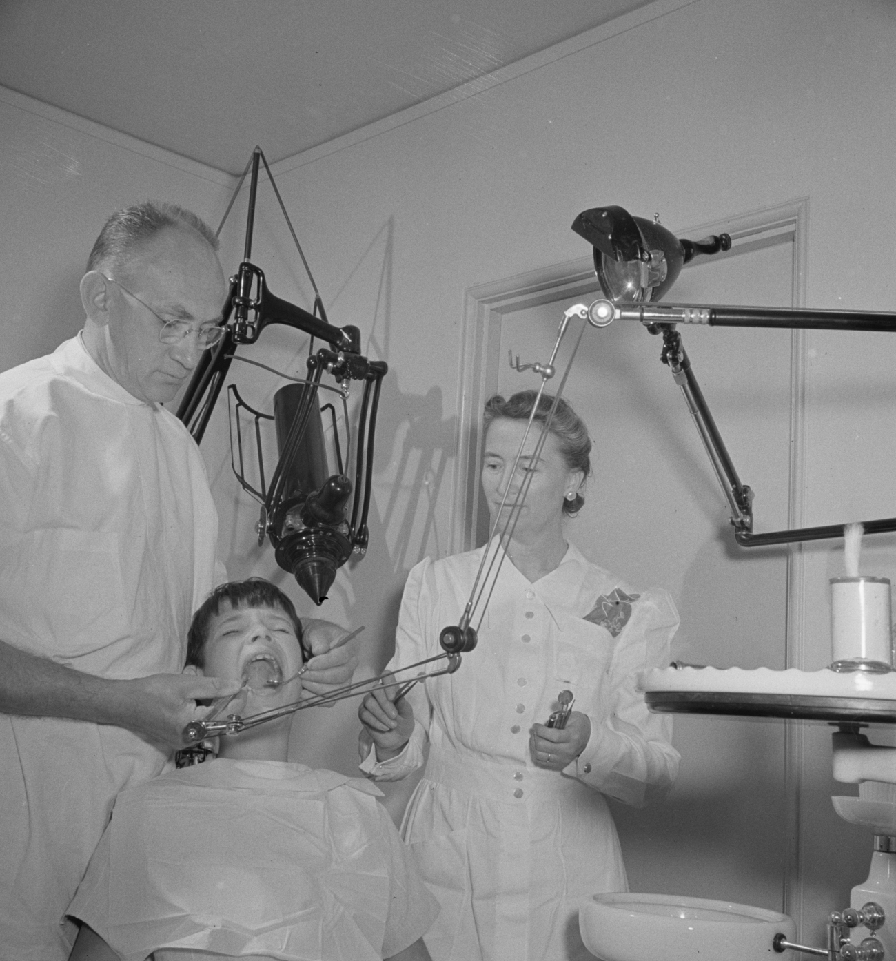 1940s Dentist Working on Child Patient