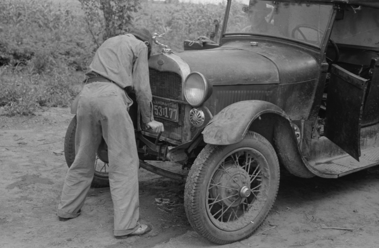 Man Starting a Crank Car in 1939