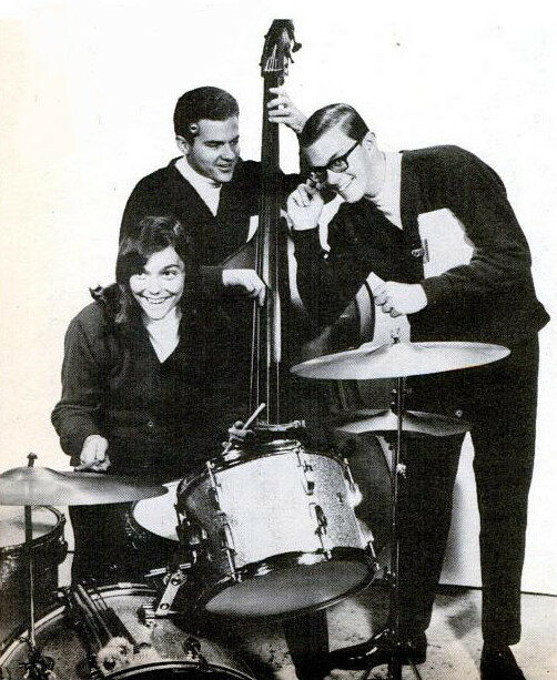 Richard Carpenter Trio smile, posing with a double bass, drums, and playful energy.