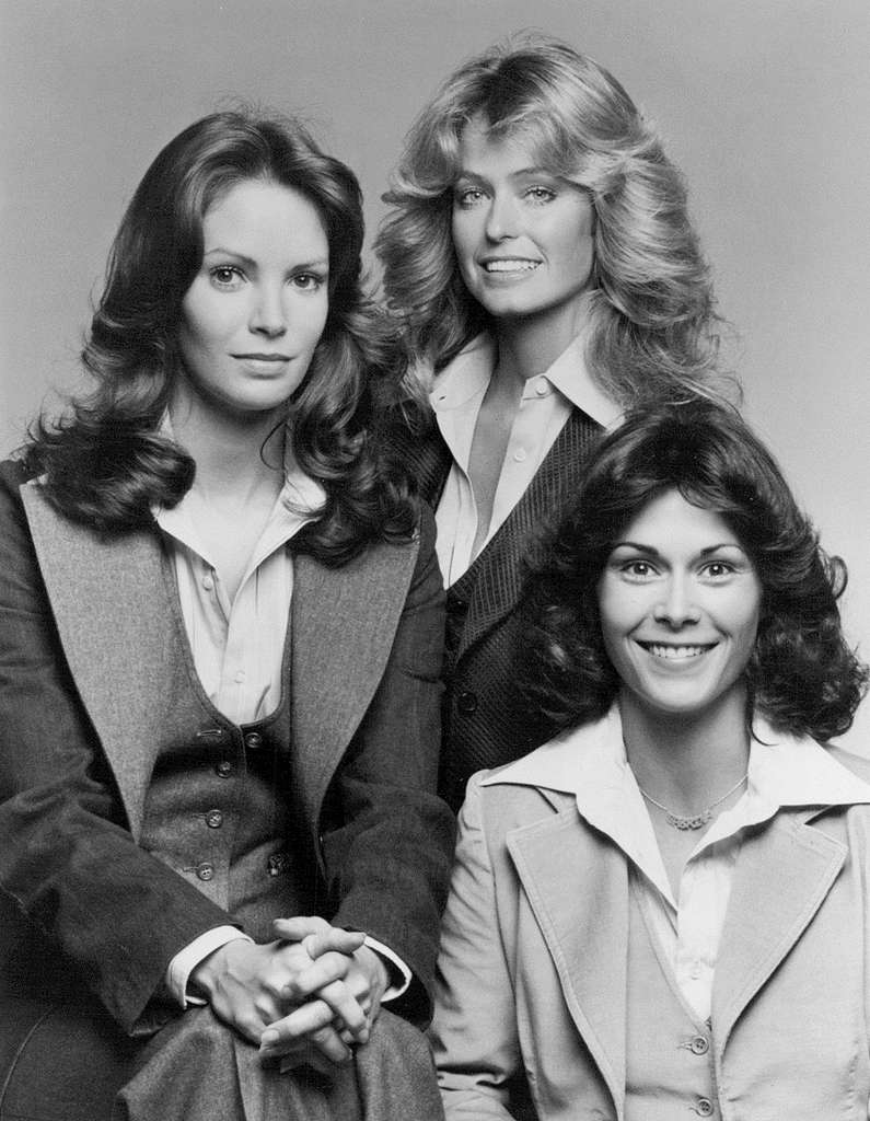 The original Charlie's Angels with blowed out hair. All three women wear suits.
