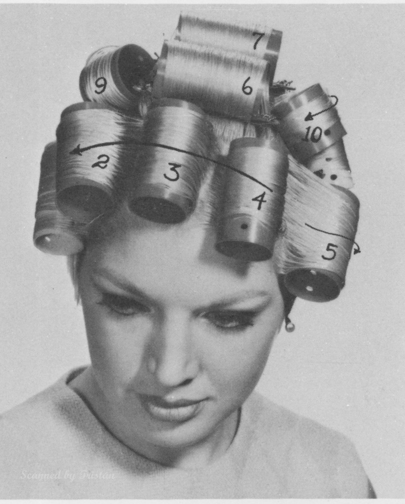 A hair rollers diagram. A woman sits and looks down with rollers in her blonde hair. Written directly on the photo are numbers and arrows depicting in what order to take the rollers out.