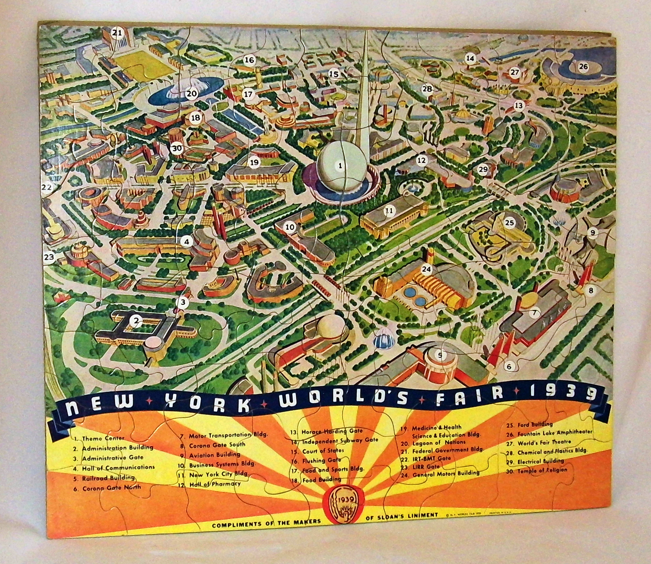 Finished 1939 jigsaw puzzle depicting that year's World Fair in New York, featuring a detailed map of the grounds and colorful attractions.