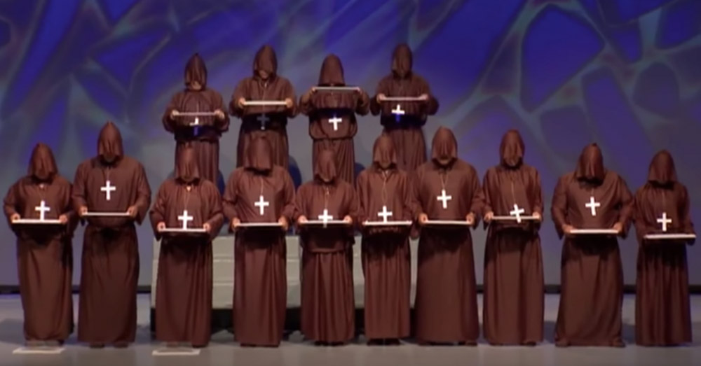 14 “Silent Monks” Line Up Onstage — Have Crowd Cracking Up With