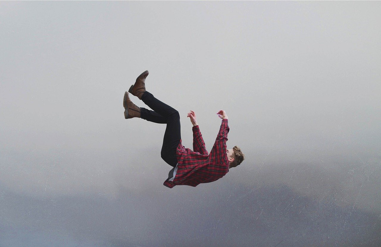 man falling off edge