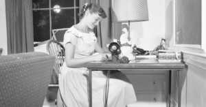 1950s teenager using a sewing machine